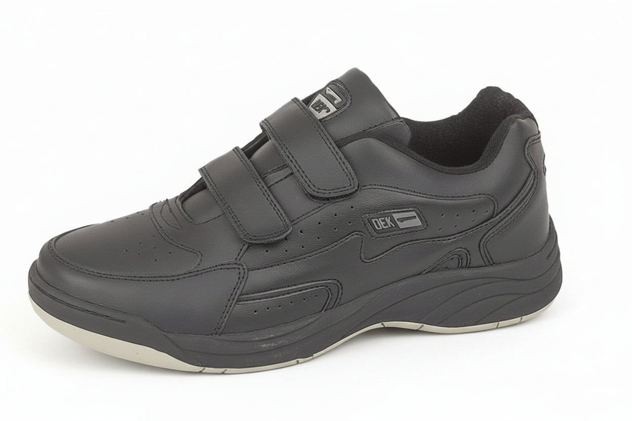 Gray shoe with velcro straps on a white background