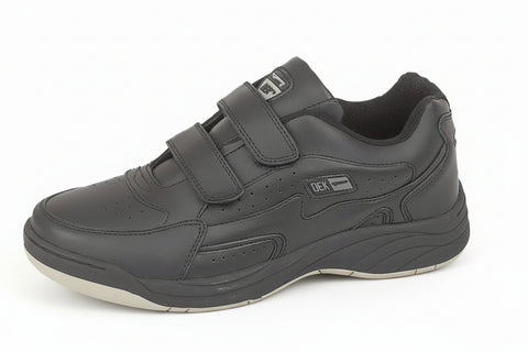 Gray shoe with velcro straps on a white background