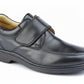 Black leather shoe with velcro strap on a white background UK Size 14 Extra Wide