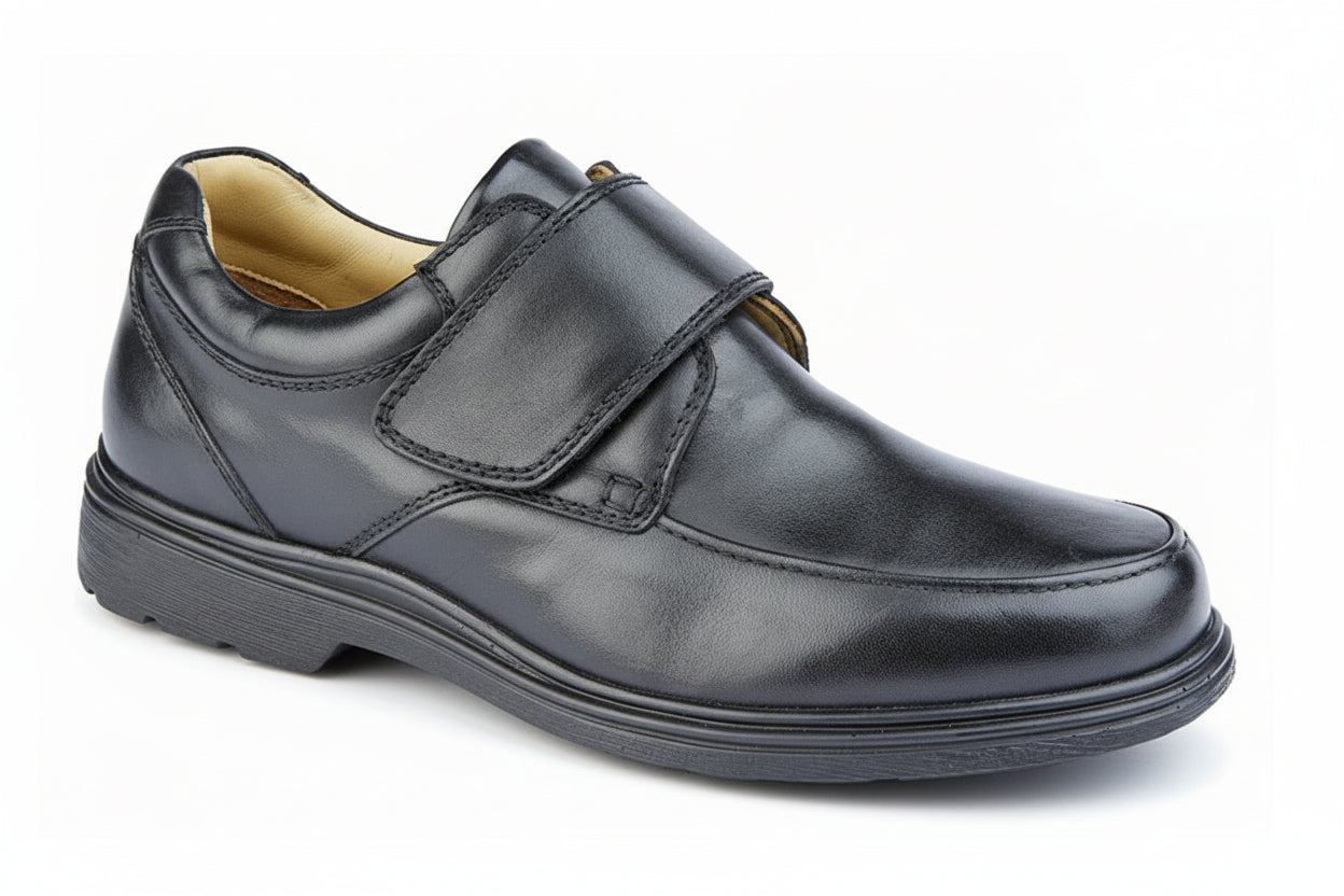 Black leather shoe with velcro strap on a white background UK Size 14 Extra Wide