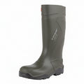 Green rubber boot on a white background UK Size 14