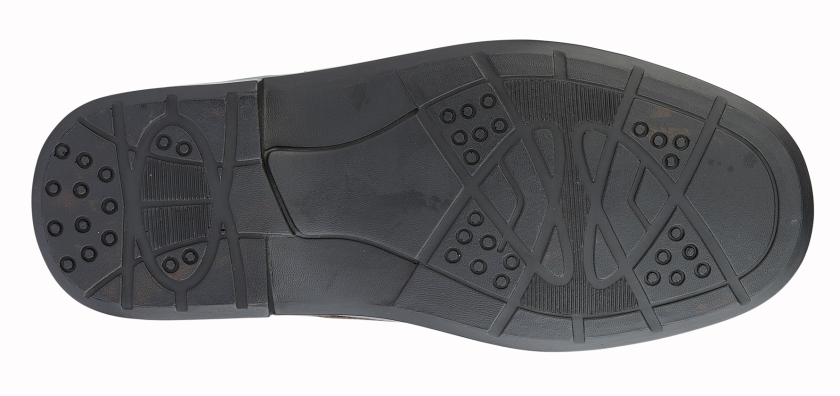 Black shoe sole with tread pattern on a white background