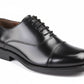 Black leather dress shoe on a white background UK Size 14