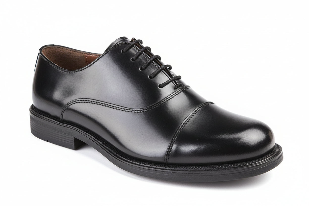 Black leather dress shoe on a white background UK Size 14