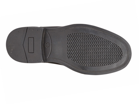 Black shoe sole with tread pattern on a white background UK Size 14