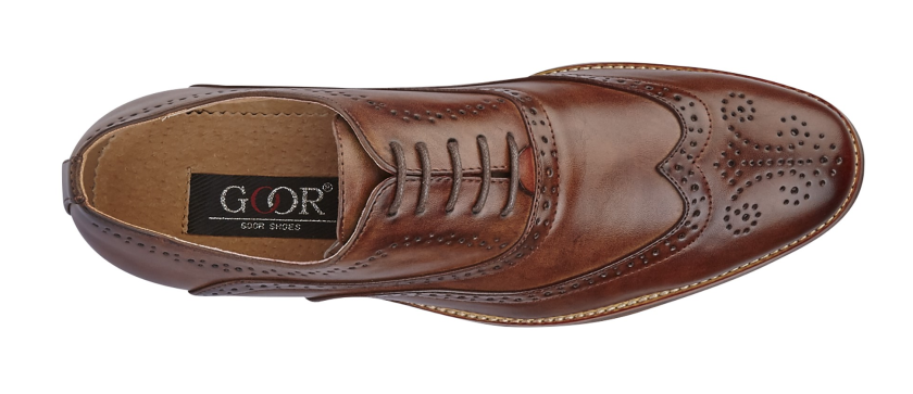 Brown leather shoe with 'Glor' branding on a white background UK Size 14