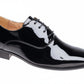 Black patent leather dress shoe on a white background UK Size 16