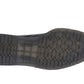Black shoe sole with tread pattern on a white background UK Size 14