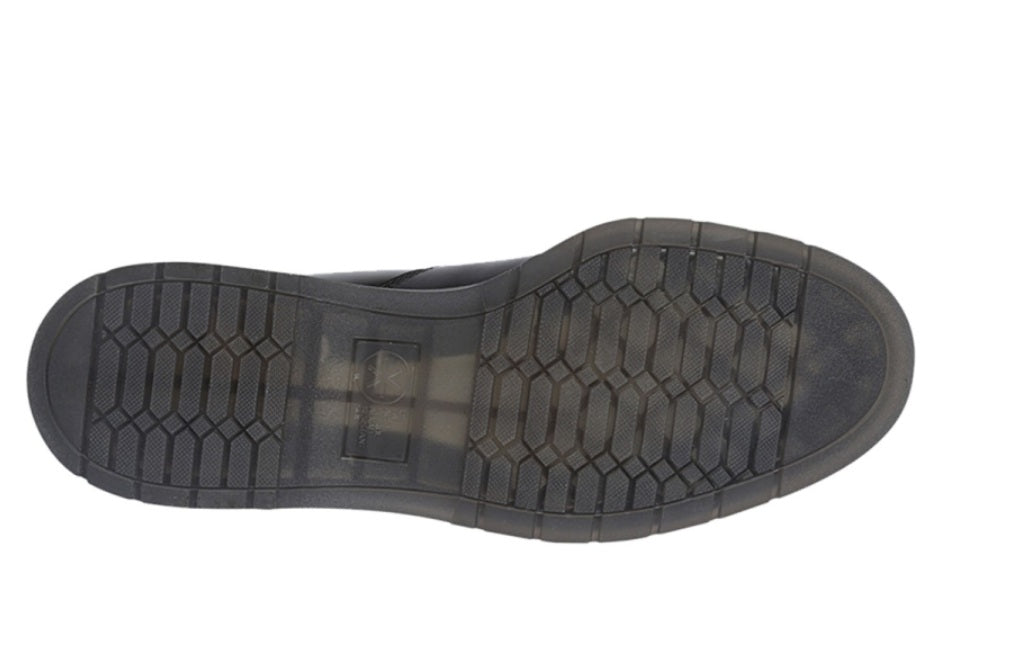 Black shoe sole with tread pattern on a white background UK Size 14
