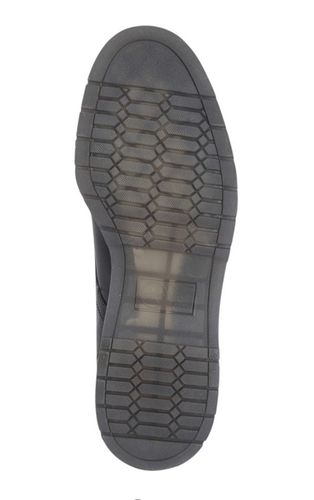Close-up of a black shoe sole on a white background UK Size 14
