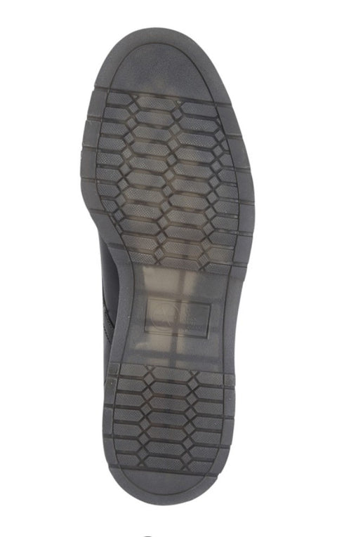 Close-up of a black shoe sole on a white background UK Size 14